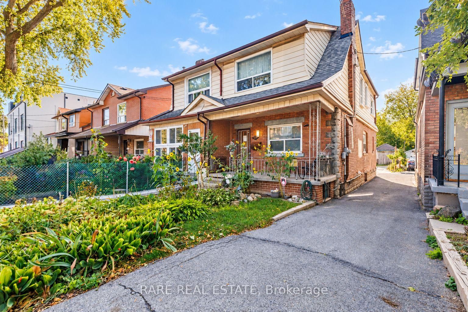 842 Shaw Street, brick front exterior with garden and private drive